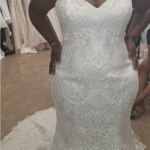 A beautiful Beige wedding dress size 20 altered to fit a size 16 or smaller